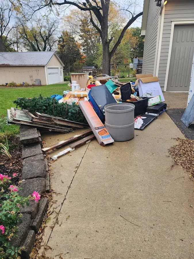 Dumpster being loaded with debris for 3 Yard Dumpster Rental in Anderson Creek